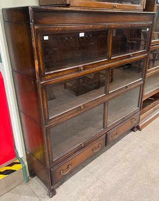 Lot 822 - A four sectional stacking bookcase comprising...