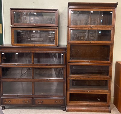 Lot 823 - An oak six sectional bookcase, the bottom...