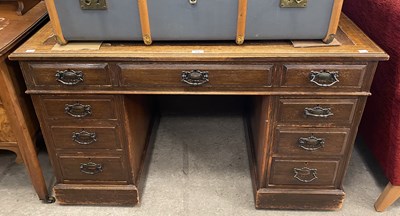 Lot 830 - A late 19th/ early 20th century oak pedestal...