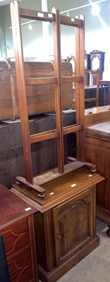 Lot 836 - A vintage mahogany towel rail with folding end...