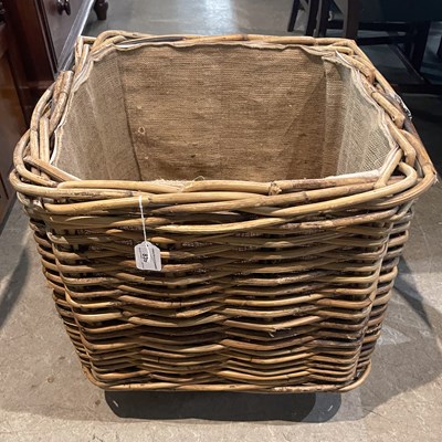 Lot 839 - A wicker square shaped log basket on castors,...