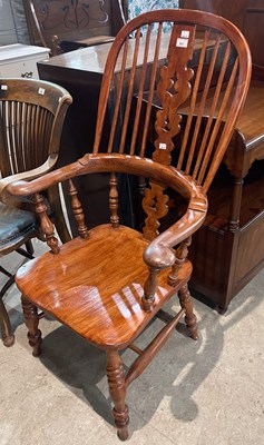 Lot 841 - An Antique Windsor type armchair, 113cm high.