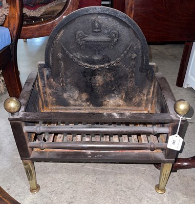 Lot 849 - A steel and brass fire basket, the back plate...