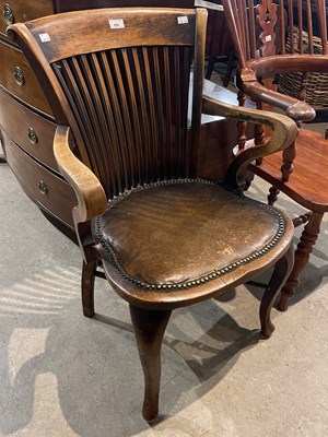 Lot 855 - A vintage stained oak Captains/ desk chair,...