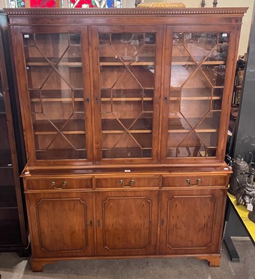 Lot 863 - A reproduction yew wood bookcase, in the...