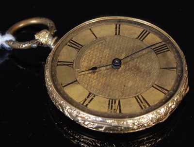 Lot 241 - A yellow metal open-faced fob watch with black...