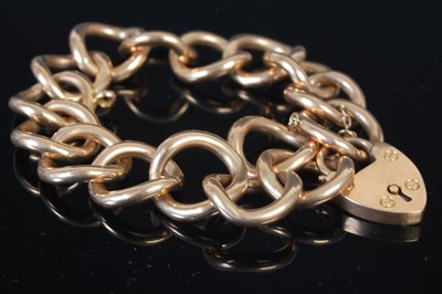 Lot 300A - A yellow metal circular link bracelet with...