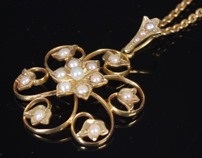 Lot 298C - A yellow metal and split pearl pendant,...