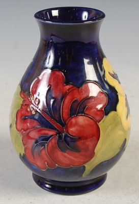 Lot 16 - A Moorcroft pottery blue ground vase,...