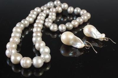 Lot 31 - A silver grey Baroque pearl necklace, 57cm...