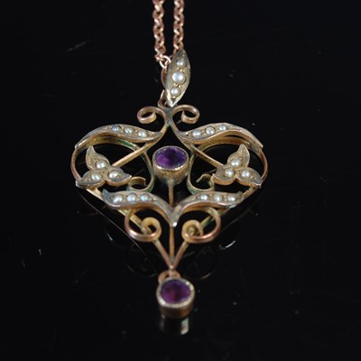 Lot 33 - An early 20th century yellow metal, amethyst...