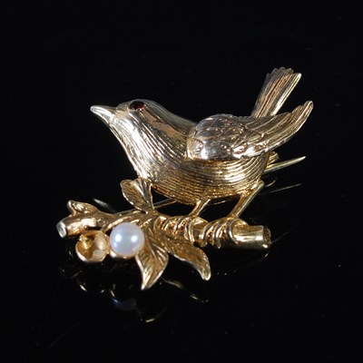 Lot 40 - A yellow metal, garnet and pearl set bird...