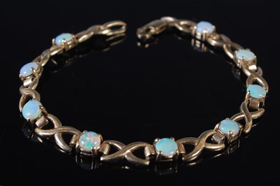 Lot 50 - A 9ct  gold and opal bracelet, 19cm long,...