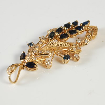 Lot 51 - A yellow metal, sapphire and diamond set...