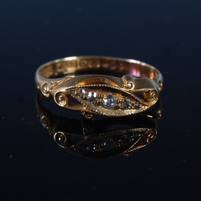 Lot 65 - An 18ct gold and diamond five stone ring, size...