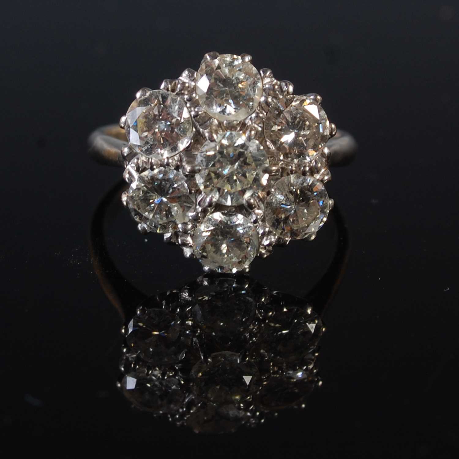 Lot 67 - A white metal and diamond cluster ring,...