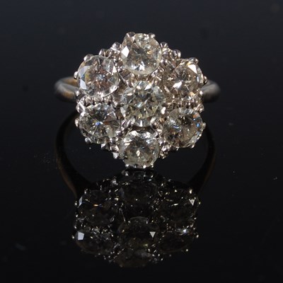 Lot 67 - A white metal and diamond cluster ring,...
