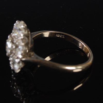 Lot 67 - A white metal and diamond cluster ring,...