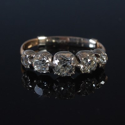 Lot 68 - A white and yellow metal five stone diamond...