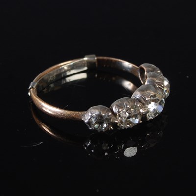 Lot 68 - A white and yellow metal five stone diamond...