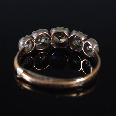 Lot 68 - A white and yellow metal five stone diamond...