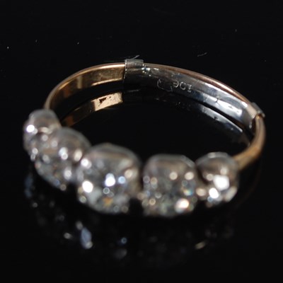 Lot 68 - A white and yellow metal five stone diamond...