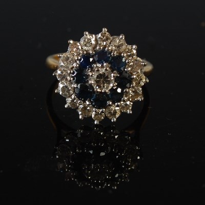 Lot 75 - An 18ct gold, sapphire and diamond cluster...