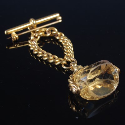Lot 88 - A 9ct gold spinner fob suspended from chain...