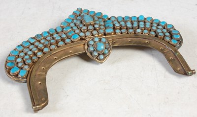 Lot 105 - A brass and turquoise set purse cantle, with...