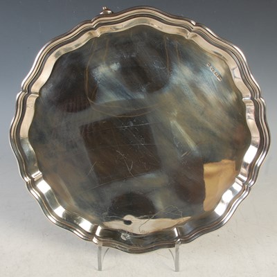 Lot 116 - A Sheffield silver salver raised on three...
