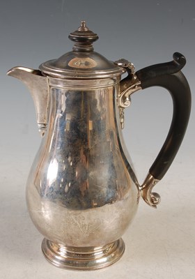Lot 135 - A London silver hot water pot, engraved with...