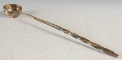 Lot 140 - A London silver toddy ladle with baleen twist...