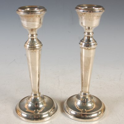 Lot 172 - A pair of Birmingham silver candlesticks,...