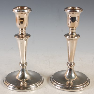 Lot 204 - A pair of Sheffield silver candlesticks,...