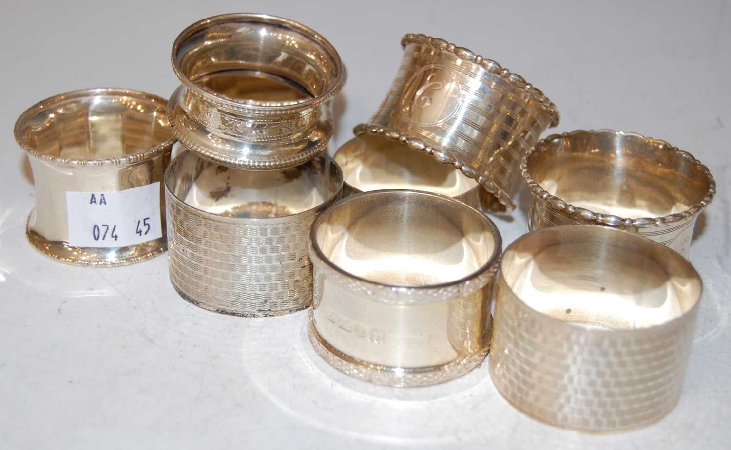 Lot 126 - Nine assorted vintage silver napkin rings,