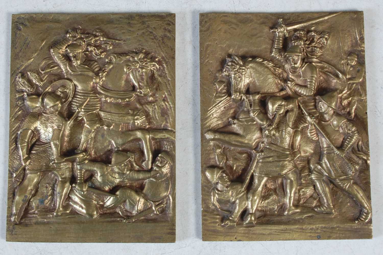 Lot 220 - A pair of bronze rectangular plaques,