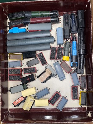 Lot 298 - A collection of miniature model N Scale trains;...