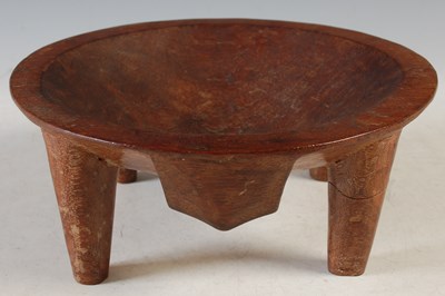 Lot 328 - A carved wood Cava bowl on four tapered...