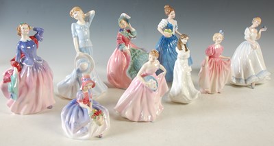Lot 337 - A collection of nine Doulton figures to...