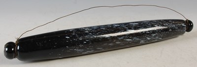 Lot 344 - A dark amber tinted glass rolling pin with...