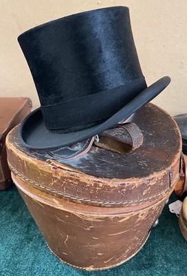Lot 368 - A vintage leather top hat box, containing...