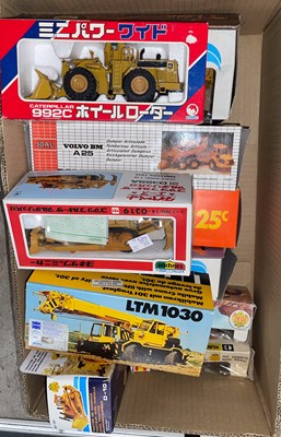 Lot 427 - A box of boxed model diggers, earth moving...