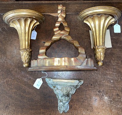 Lot 527 - A giltwood wall bracket, with demi-lune shelf...