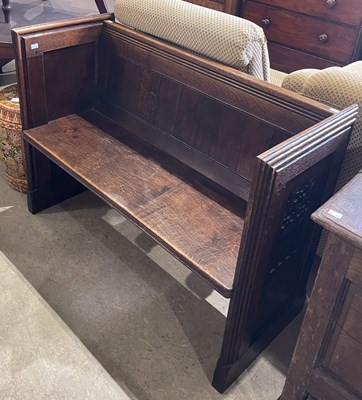 Lot 560 - A late 19th century stained oak Gothic pew of...