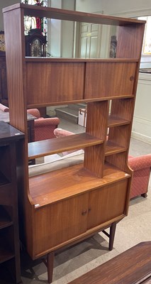 Lot 570 - A mid-century double sided teak free-standing...