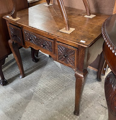 Lot 578 - An Antique oak lowboy, the rounded rectangular...