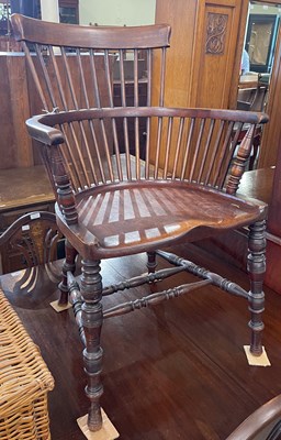 Lot 582 - An early 20th century spindle back armchair,...