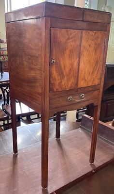 Lot 584 - A 19th century mahogany washstand, the hinged...