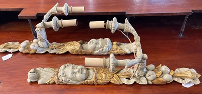 Lot 590 - A pair of carved and painted wooden two light...