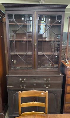 Lot 814 - A George III style mahogany secretaire...